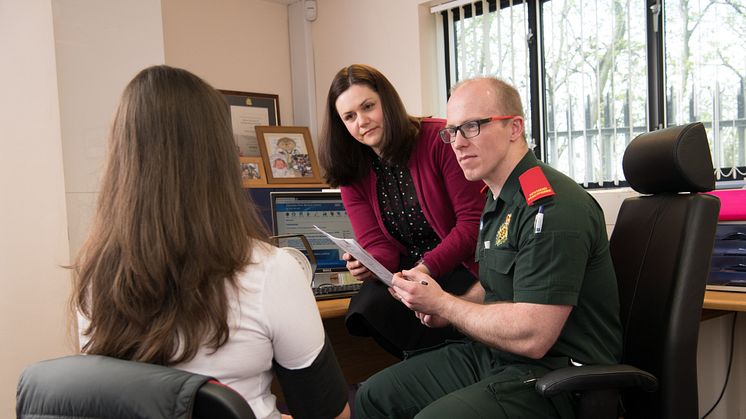 Dr Caroline Jeffery with Advanced Paramedic Wesley Scaife and a patient