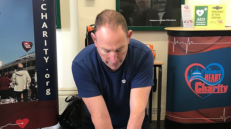 Steve Morris, demonstrating the use of an AED, followed by CPR, in 2018