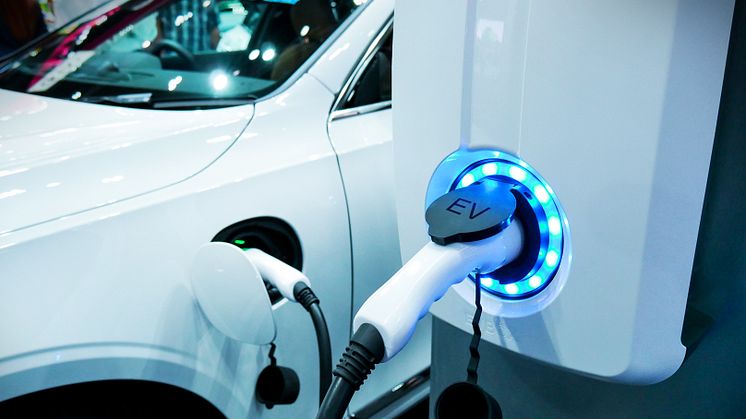 An electric vehicle being charged