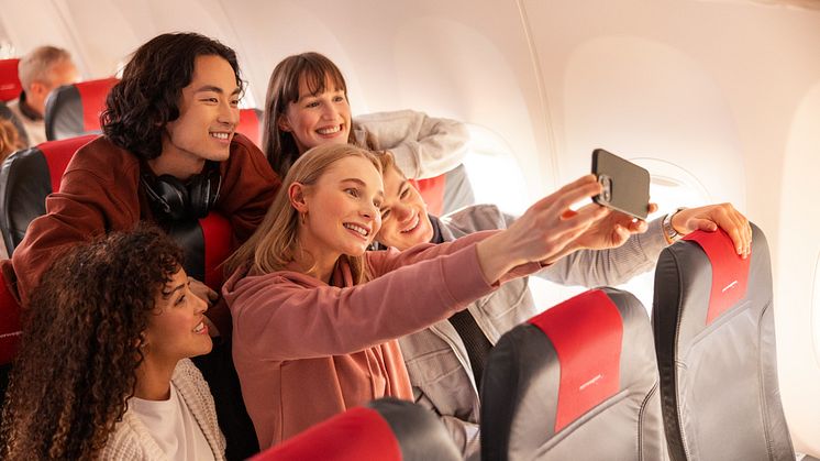 Young people on board Norwegian flight