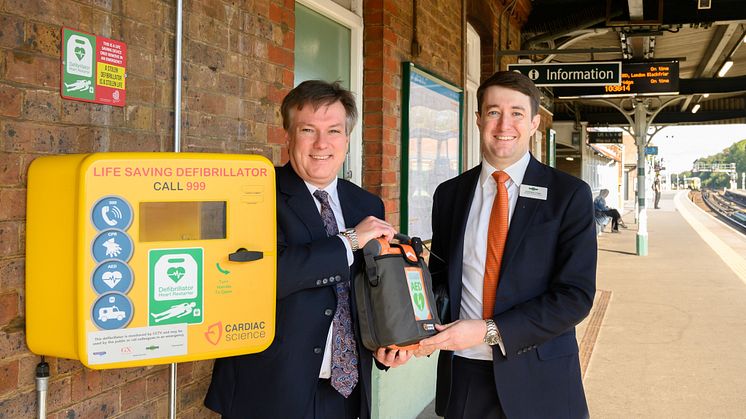 Defibrillators at every station - pictured at Three Bridges station with local MP