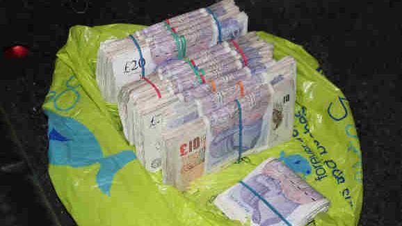 Op Quadrant Bundles of cash seized 2