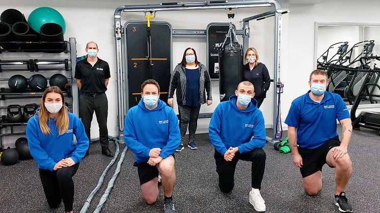 Cllr Andrea Simpson (back, centre) at the new digital-friendly gyms with Mike Taylor and Zilpha Lang, with (front) gym instructors Lizzie, Neil, Ben and Jordan.