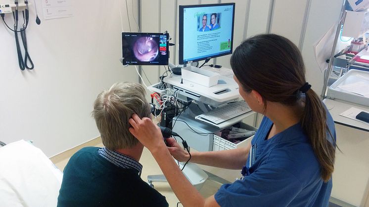 Nurse examines patient with internet connected instruments, so that a doctor in another city can diagnose.