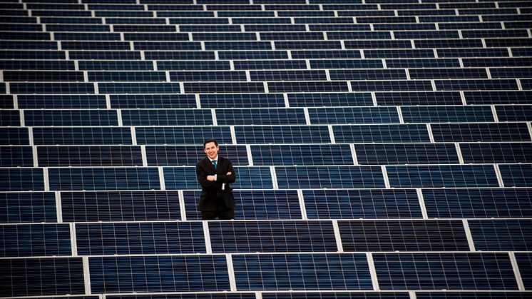 Damon Kent with the solar array on the roof of Sport Central 1