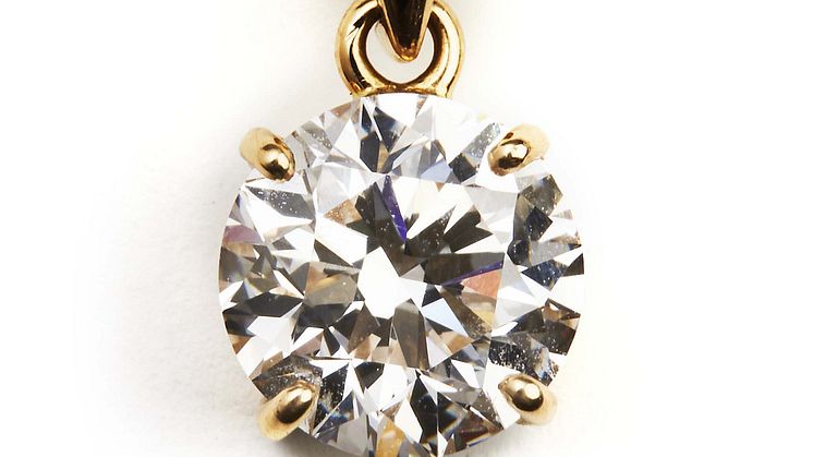 A diamond pendant set with a brilliant-cut diamond
