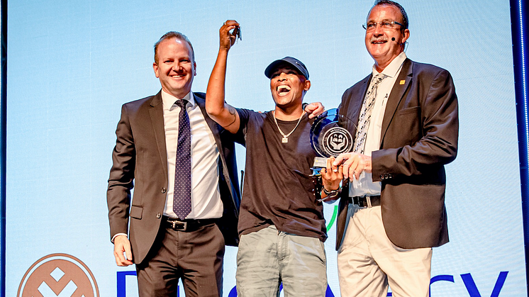 Discovery Insure CEO Anton Ossip (left) hands over the car keys to 2019 winner, Peterus Wagner, accompanied by ChildSafe chairperson Professor Sebastian Van As (right).