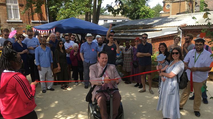 Gardeners' World presenter Mark Lane cuts a ribbon to mark the official opening of Crofton Park Railway Garden