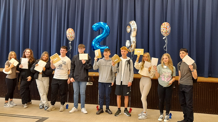 Students at Bury CE High School celebrate their results.