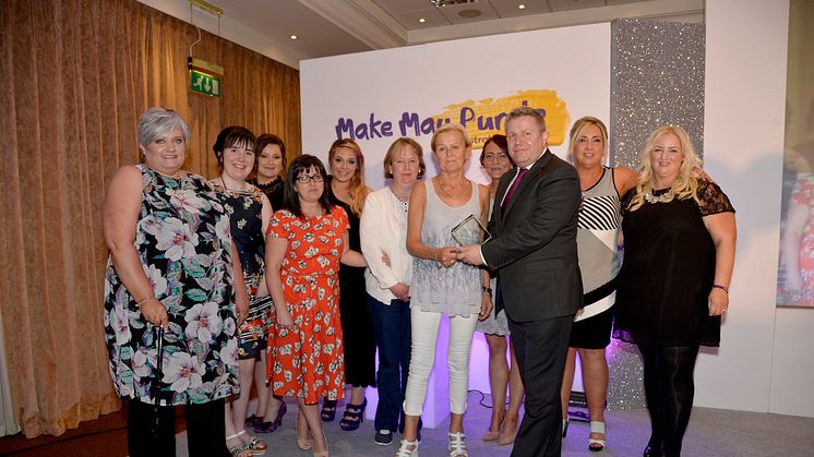 Young Women after Stroke Group receive the fundraiser of the year award from Tony Bicknell, Royal Mail