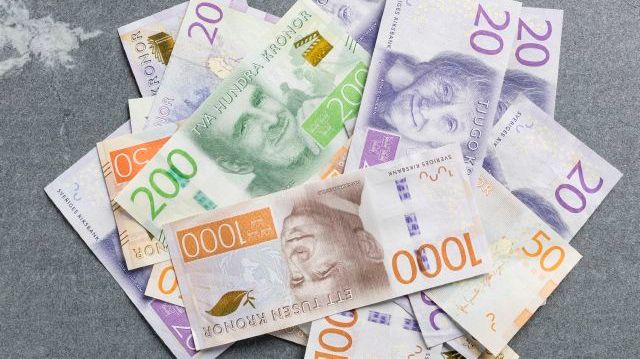 Genrebild på svenska sedlar. Foto: Scandinav bildbyrå