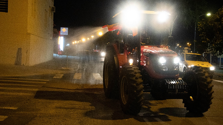 A Solis 90 CV tractor disinfects the streets of Indaiatuba, Brazil.