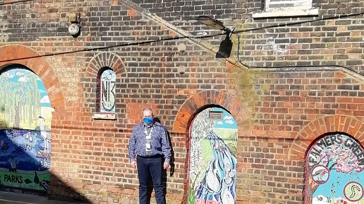 Palmers Green mosaics - station manager Duncan Primrose