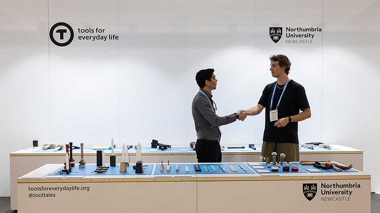 Northumbria Designer in Residence Joe Smith (right) greeting a visitor at the International Furniture Fair in New York