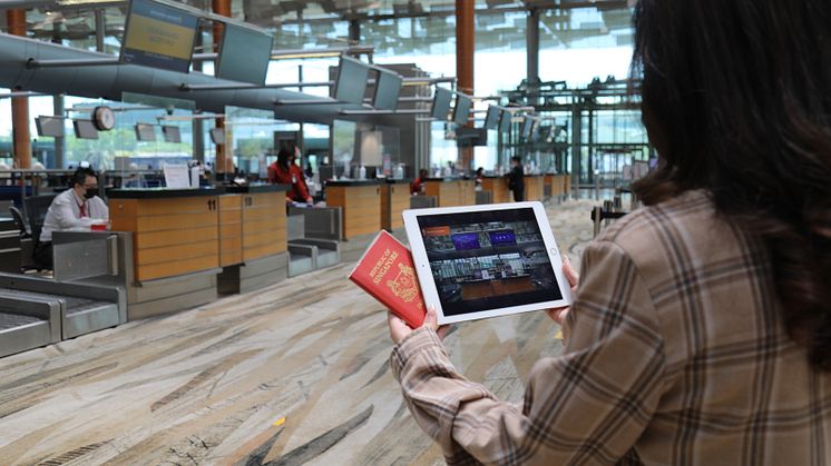 Passenger using social story tool during check-in.jpg