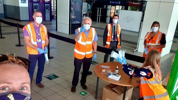 Staff at Milton Keynes station handed out face coverings during their first week of compulsory use