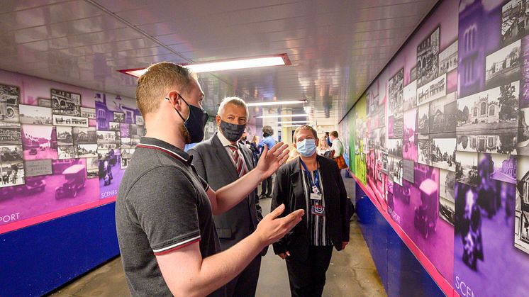 Historic scenes: Matthew Platt of North Herts Museum tells Herts County Councillor Phil Bibby and GTR Area Manager Karen Gregson how the station's photographic history murals were created