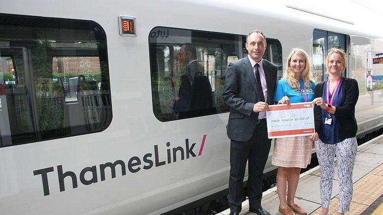 Ben Groome, Operational Change and Implementation Manager, and Sarah Breed, Local Operations Manager, members of the cycling team at Luton, present the money to Caron Hooper, Corporate Fundraiser at Keech Hospice Care (centre)