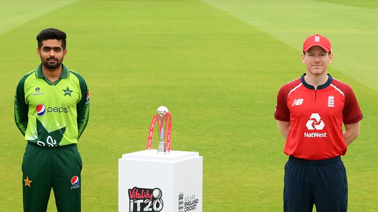 Babar Azam of Pakistan(L) and Eoin Morgan of England(R) pose next to the trophy for the Vitality IT20 series during an England Net Session at Emirates Old Trafford on August 27, 2020 in Manchester, England. (Photo by Stu Forster/Getty Images for ECB)