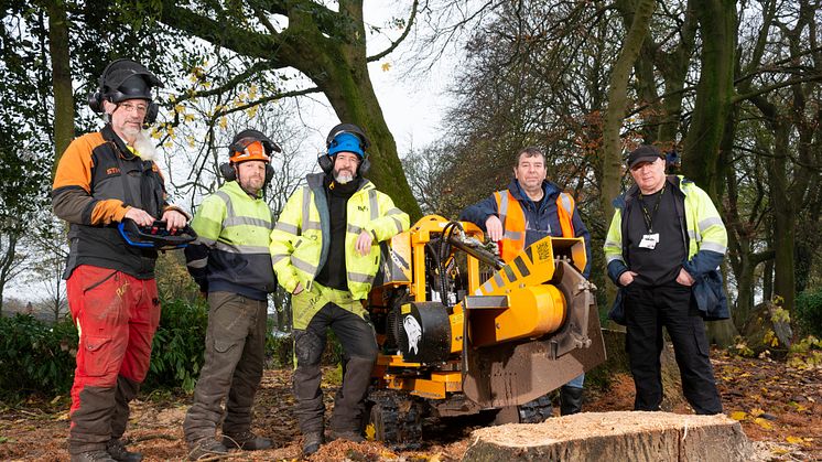 Cllr Alan Quinn (second from right) with the grounds maintenance team and the new machinery for tree stump removal.