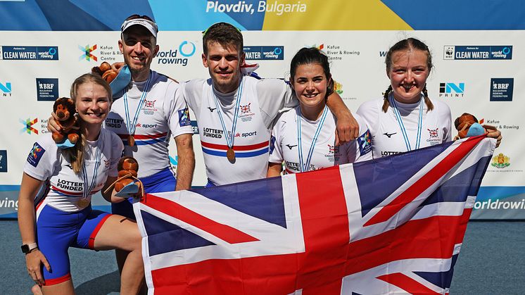 Ellen Butrick (far right) with her teammates winning gold at the World Championships. Photo credit: British Rowing/Naomi Baker