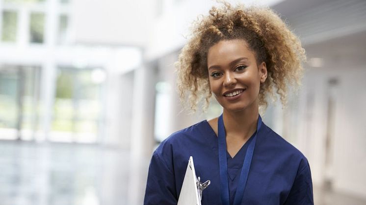 17821296-portrait-of-female-nurse-wearing-scrubs-in-hospital