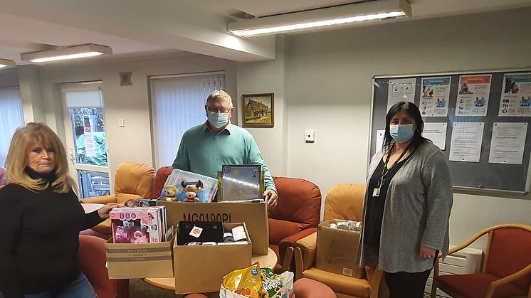 Colin Harrison of Trinity Green food bank collects the donations with staff members Claire Hill and Christine Whittaker.