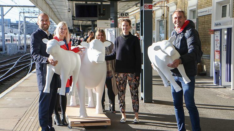 Thameslink and Great Northern Managing Director Tom Moran, GTR's Head of Marketing Emma Wiles,  Ellie Edge from Wild in Art, artist Emily Pettitte and Peter Marron from Wild in Art accompany three cows on a train trip. MORE IMAGES AVAILABLE BELOW.