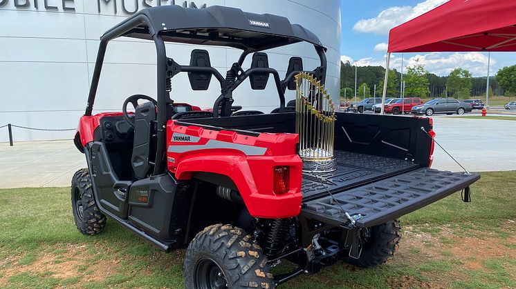 The Atlanta Braves 2021 World Champions Trophy hitches a ride on a Yanmar UTV.