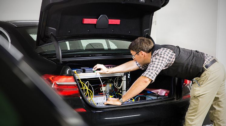 BMW engineer, André Mueller, tests autonomous driving technology in a BMW autonomous test car