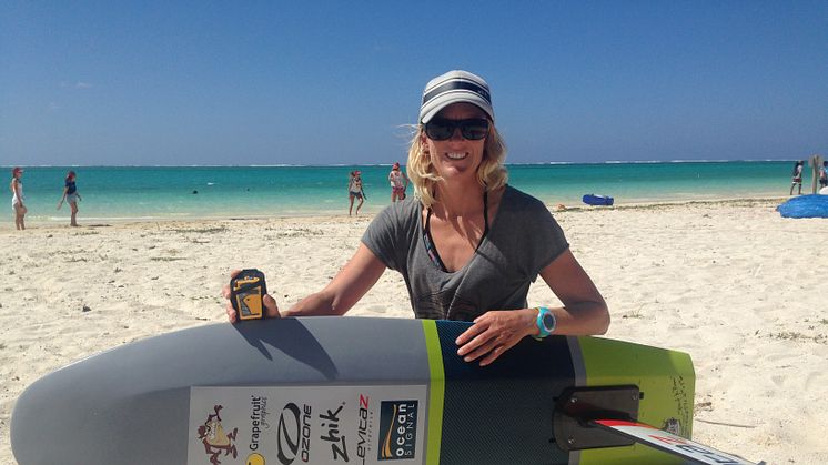 Top female kite racer Gina Hewson with her Ocean Signal rescueME PLB1