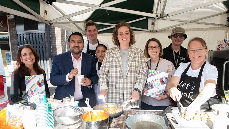 The Bury Market team show you how to cook well for less, with (front, centre) Cllrs Tamoor Tariq and Charlotte Morris.