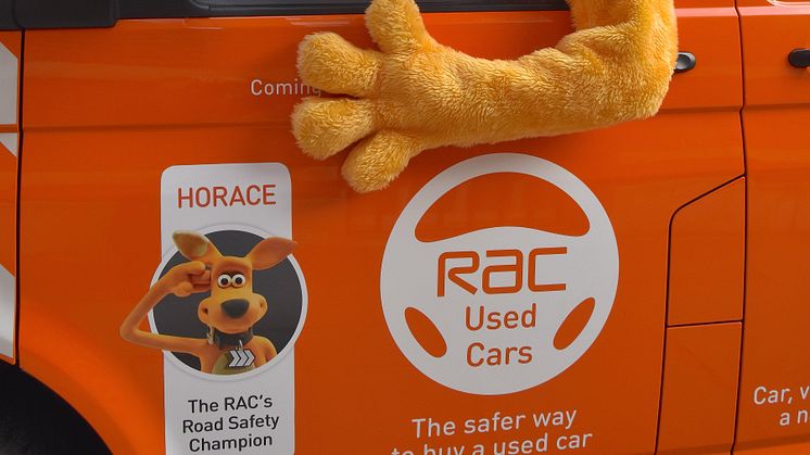 Horace giving a wave from an RAC patrol van