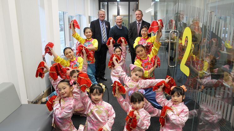 Local families Celebrate Chinese New Year in North Glasgow. ng homes Chairperson John Fury and CEO Robert Tamburrini are joined by Bob Doris MSP and dancers from Glasgow Oriental Dancing Association. 
