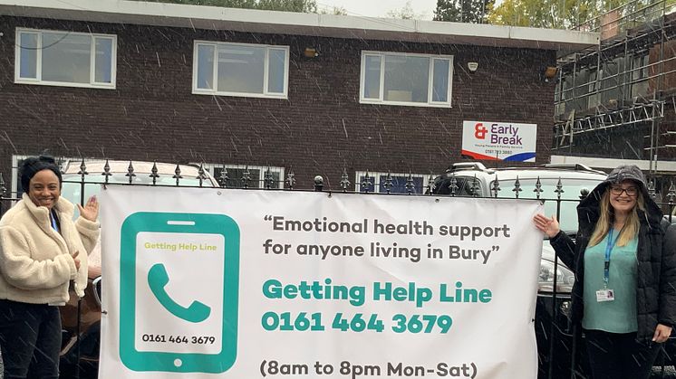 With the Getting HelpLine banner are (left) Dionne Treasure, EHWB (Early Intervention) Worker and Gemma Philburn, EHWB manager.