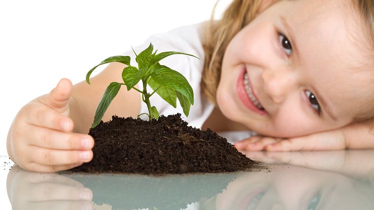 670228-little-girl-happy-about-her-plant.jpg