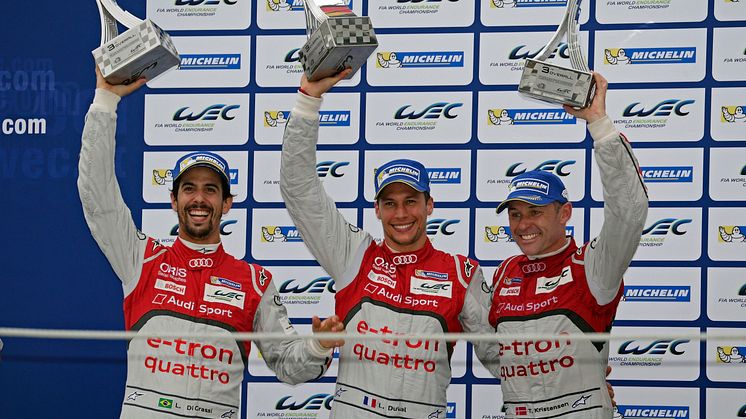 Lucas di Grassi, Loïc Duval, Tom Kristensen on the podium