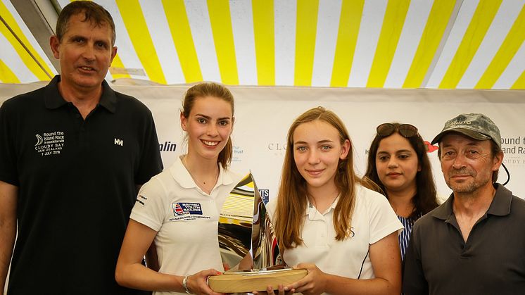 Hattie Rogers (left) and Paige Flide (right) from Hampshire Collegiate School receiving the Raymarine Young Sailor Trophy after this year's Round the Island Race 