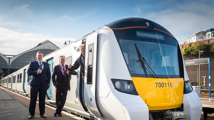 Carl Edwards, Station Manager at Brighton and Paul Bradley (Driver Manager) give a thumbs up with train driver Alan Stacey at Brighton Station before the new 12-carriage Thameslink Class 700 departs at Brighton this morning (18 September)