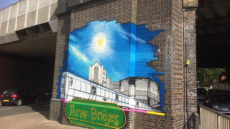 The eye-catching mural on a railway bridge outside Three Bridges station