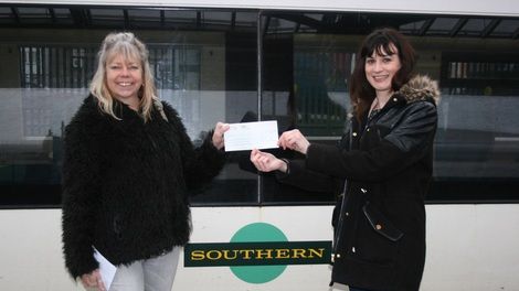 Embrace's Rebecca Whippy receives the cheque form Southern's Su Rogers