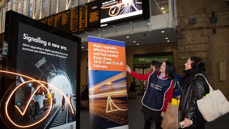 ECDP team talks to passenger at King's Cross, Network Rail