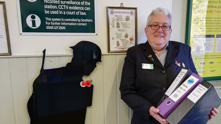 Laura Lee pictured with her research into Brighton railway workers who served in the Great War 