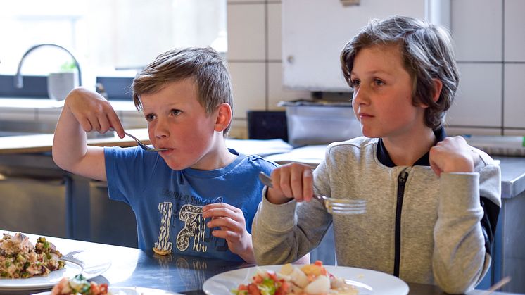 Children enjoying seafood