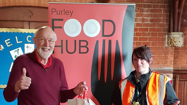 Southern driver Laura McDonald gives food bank administrator Steve Hunt donations for Purley Food Hub