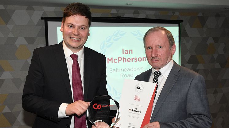 Martijn Gilbert, Go North East managing director, presenting Ian McPherson with his award