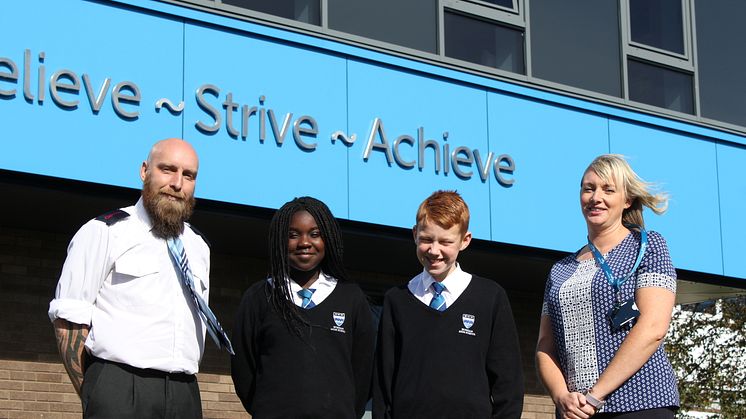 Phillip Barnfather from Go North East and Rebecca Rutter from Age UK North Tyneside with students from Norham High School.