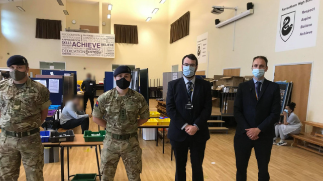 In action at Parrenthorn – soldiers from the 5th Regimental Royal Artillery, with council leader Eamonn O’Brien and deputy head teacher Allen Hall.