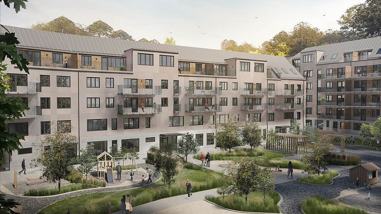 Vy över bostadshus och gården - gemensam för boende och förskola