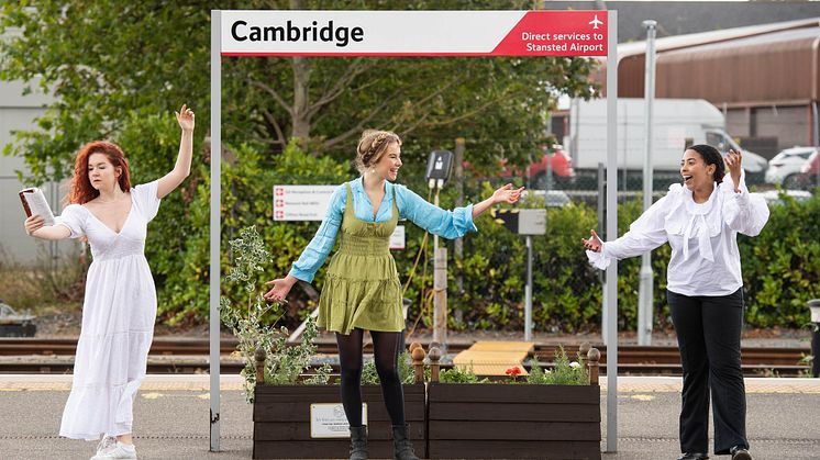 Actors celebrate the new partnership at Cambridge station